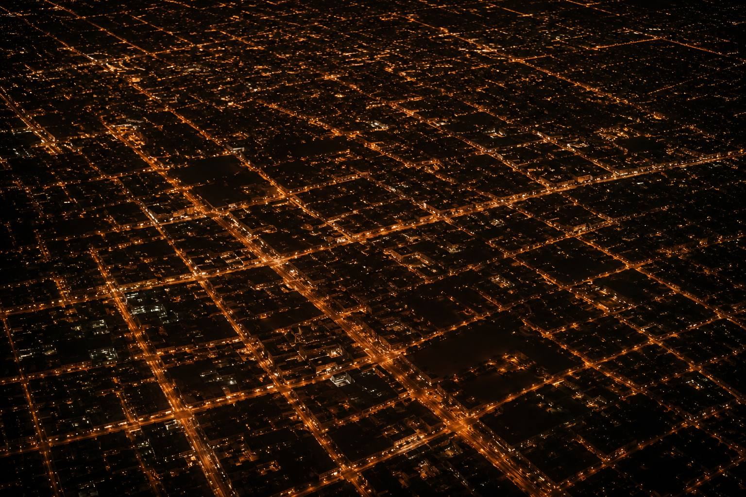 A city grid at night — every light a business